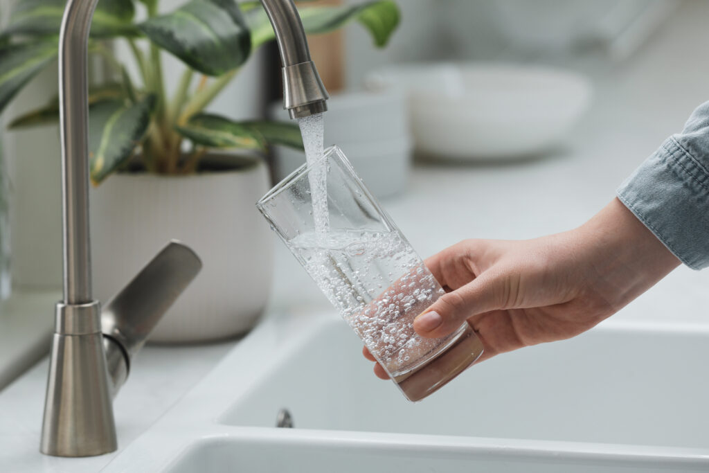 Filling glass from kitchen tap
